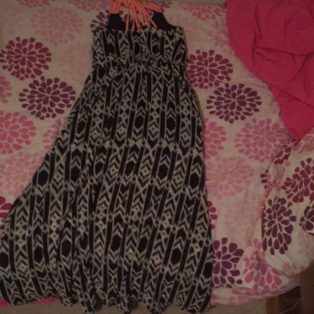 A long dress with coral straps and a nice print